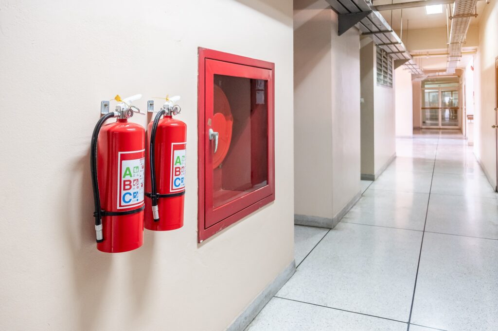 Fire extinguisher system on the wall background,